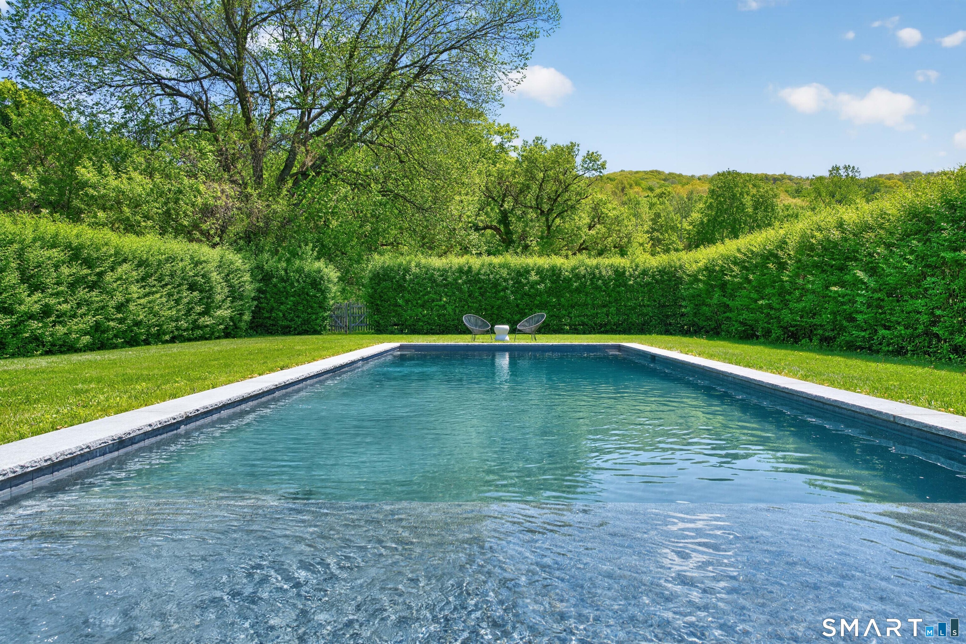100 North Main Street Kent, CT 06757 - Photo 4 of 40 a view of a swimming pool with a yard