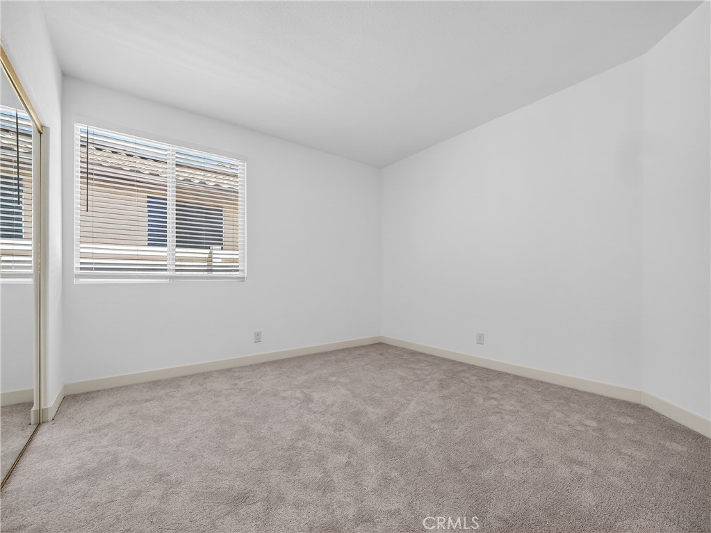 1436 Riviera Avenue Banning, CA 92220 - Photo 33 of 43 an empty room with a window