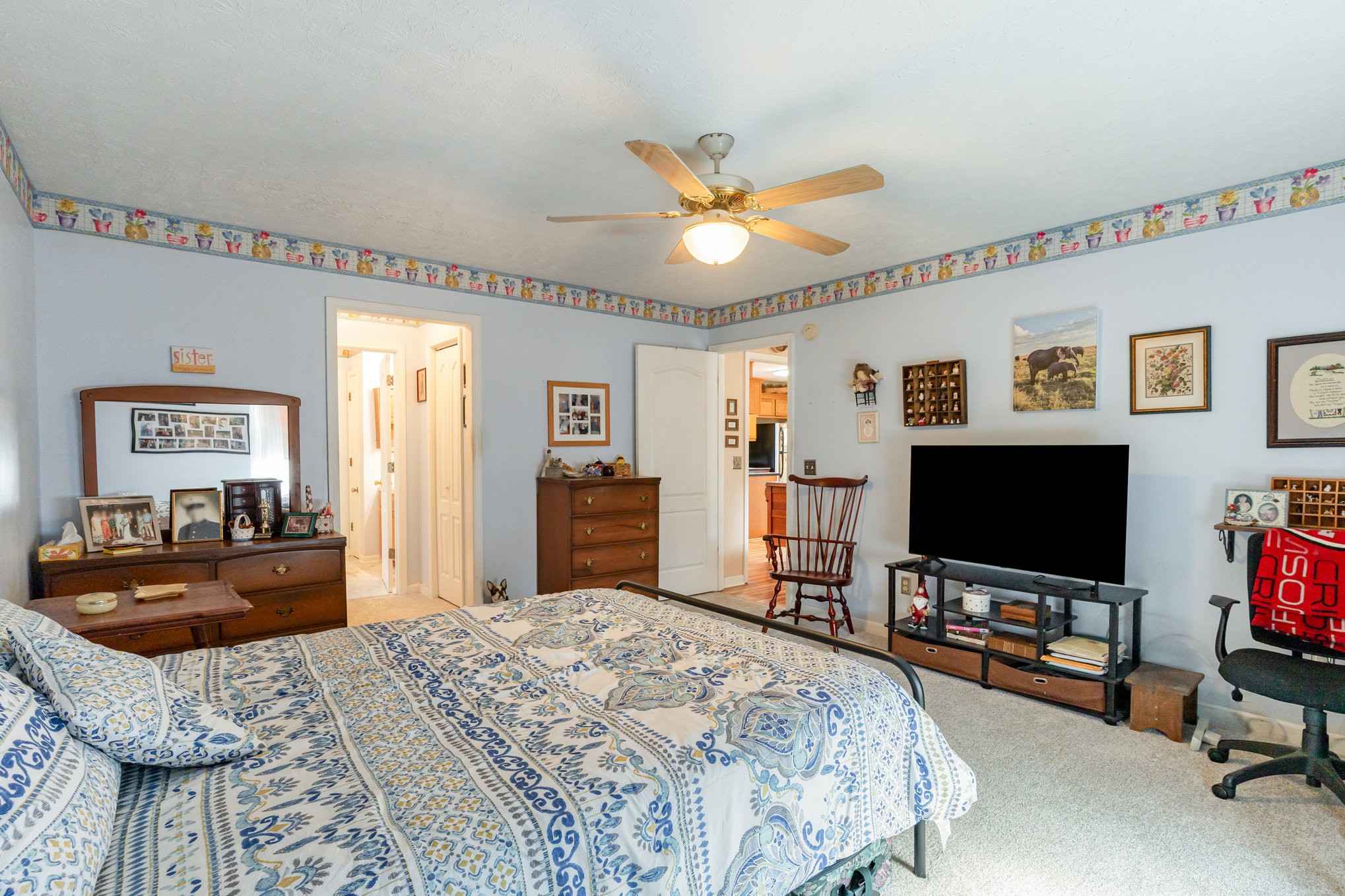 1180 Simms Heights Road Kingston Springs, TN 37082 - Photo 13 of 31 a bedroom with a bed and a flat screen tv