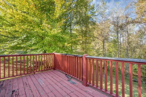 a view of balcony with wooden floor