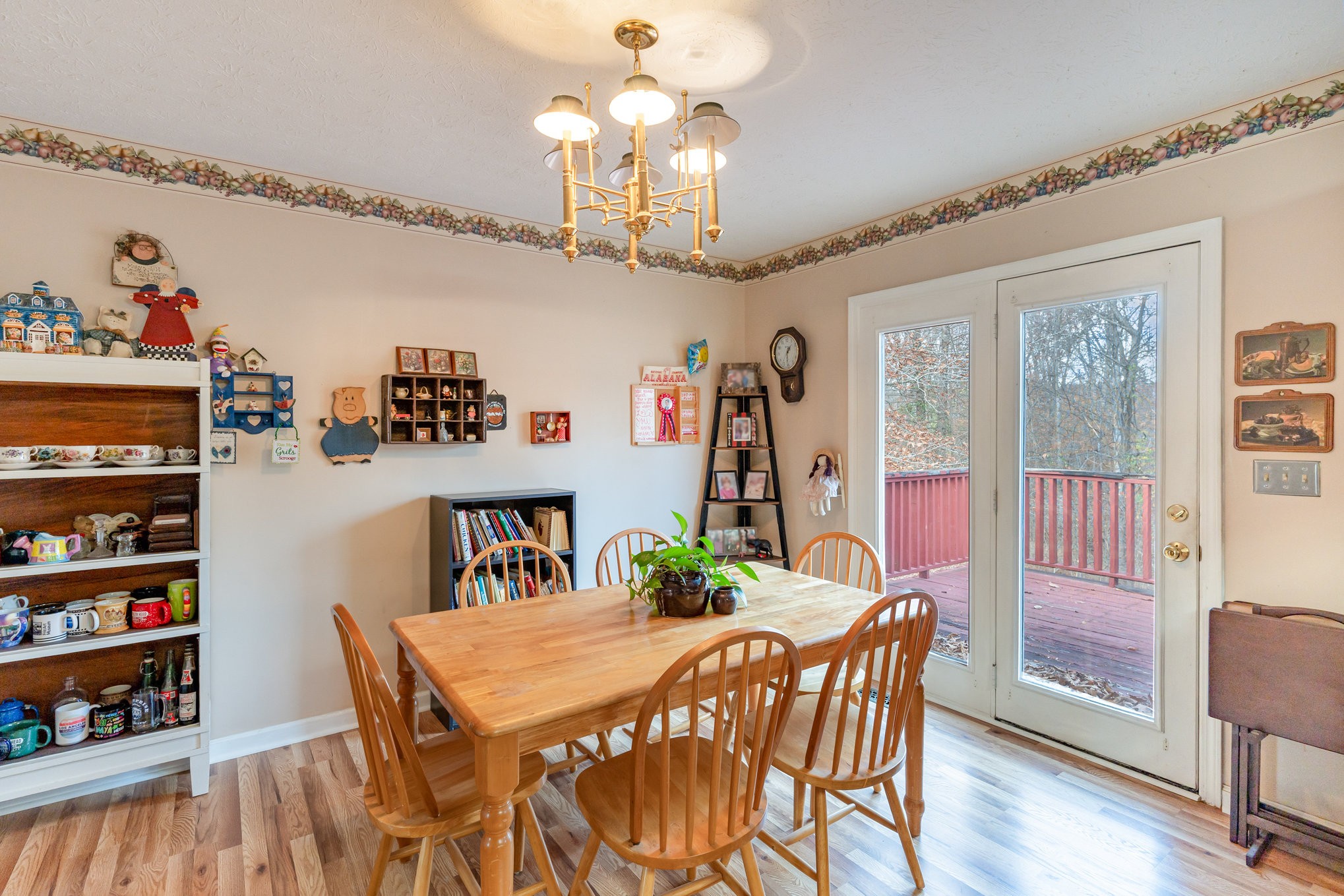 1180 Simms Heights Road Kingston Springs, TN 37082 - Photo 8 of 31 a view of a dining room with furniture a chandelier and wooden floor