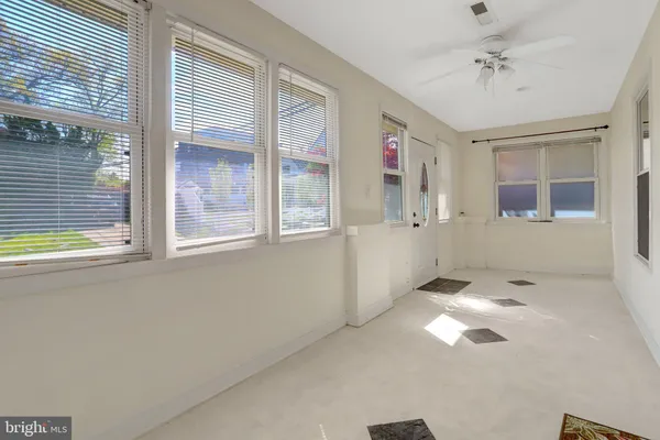 an empty room with wooden floor
