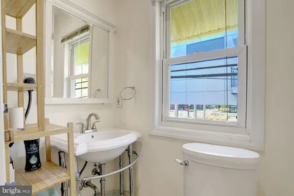 a kitchen with cabinets stainless steel appliances and sink