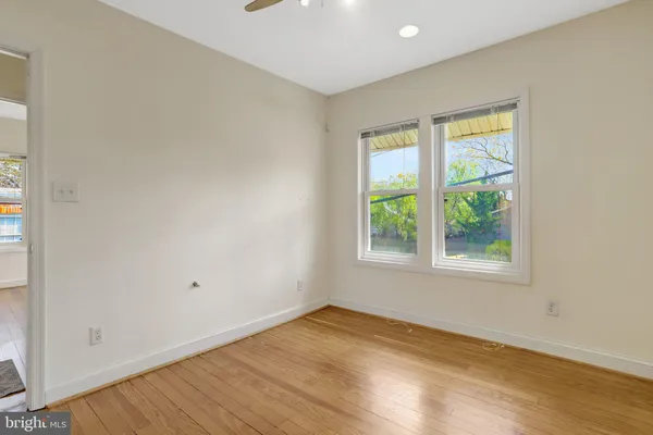 a kitchen with granite countertop a stove and a microwave