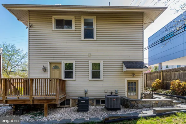 a front view of a house with a yard and outdoor seating