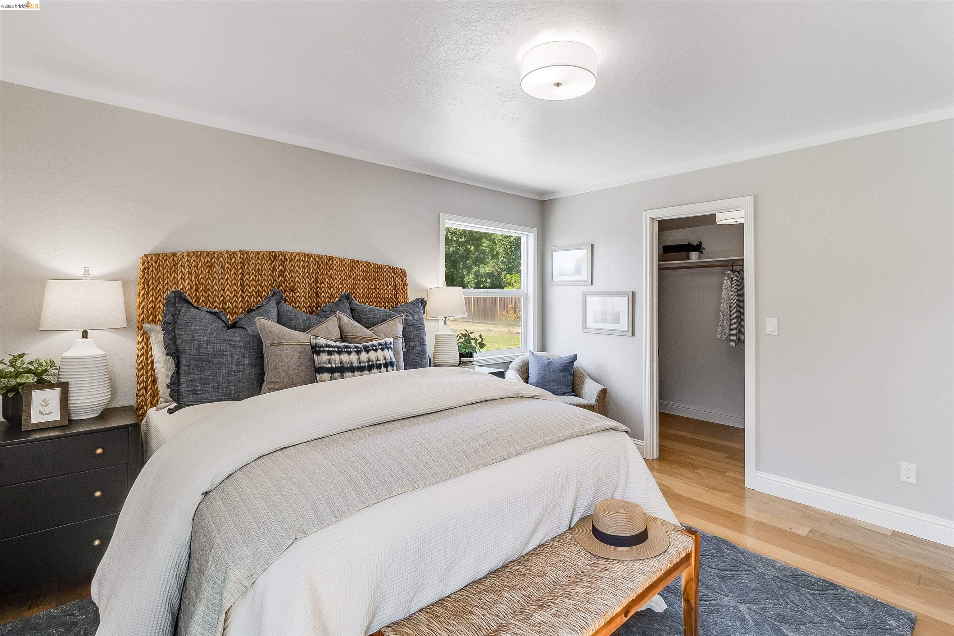 346 Valley View Road Pleasant Hill, CA 94523 - Photo 21 of 57 Spacious bedroom featuring light wood-finish flooring, a window offering exterior views, and a closet with a built-in hanging rod