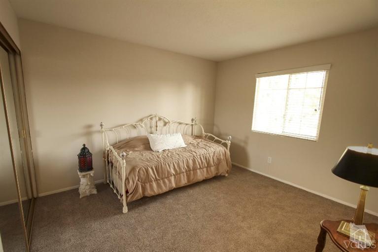 2169 Rhoda Street Simi Valley, CA 93065 - Photo 17 of 21 a bedroom with a bed and a window