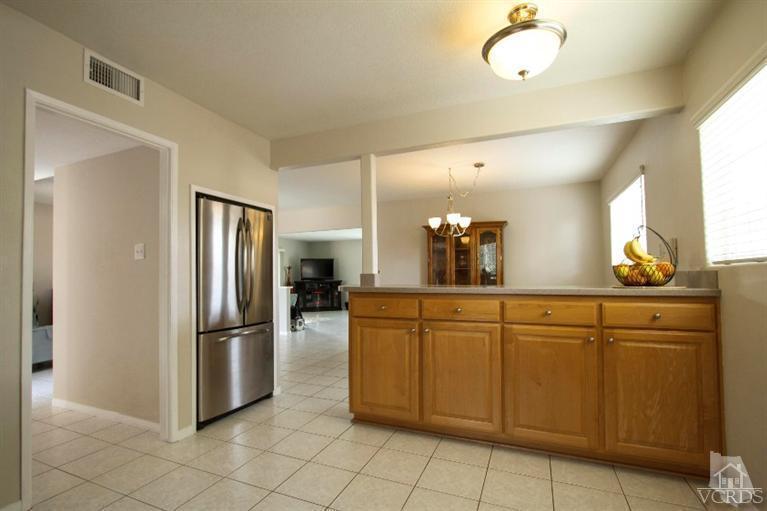 2169 Rhoda Street Simi Valley, CA 93065 - Photo 6 of 21 a kitchen with cabinets and stainless steel appliances