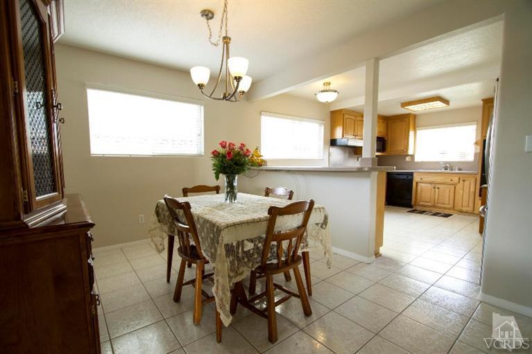 2169 Rhoda Street Simi Valley, CA 93065 - Photo 8 of 21 a view of a dining room with furniture and a chandelier