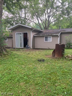 3065 Polly Road Ravenna, OH 44266 - Photo 5 of 11 Back of house featuring a yard