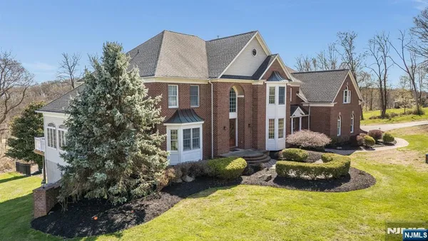 a view of a house with backyard porch and sitting area