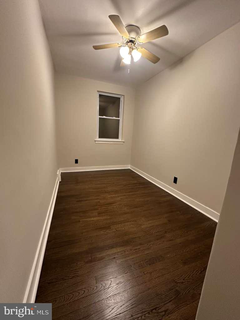 8509 Temple Road Philadelphia, PA 19150 - Photo 13 of 16 wooden floor in an empty room with a window