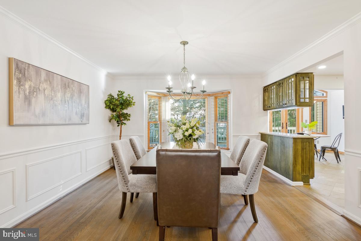 9804 Korman Court Potomac, MD 20854 - Photo 11 of 66 a view of a dining room with furniture window and wooden floor
