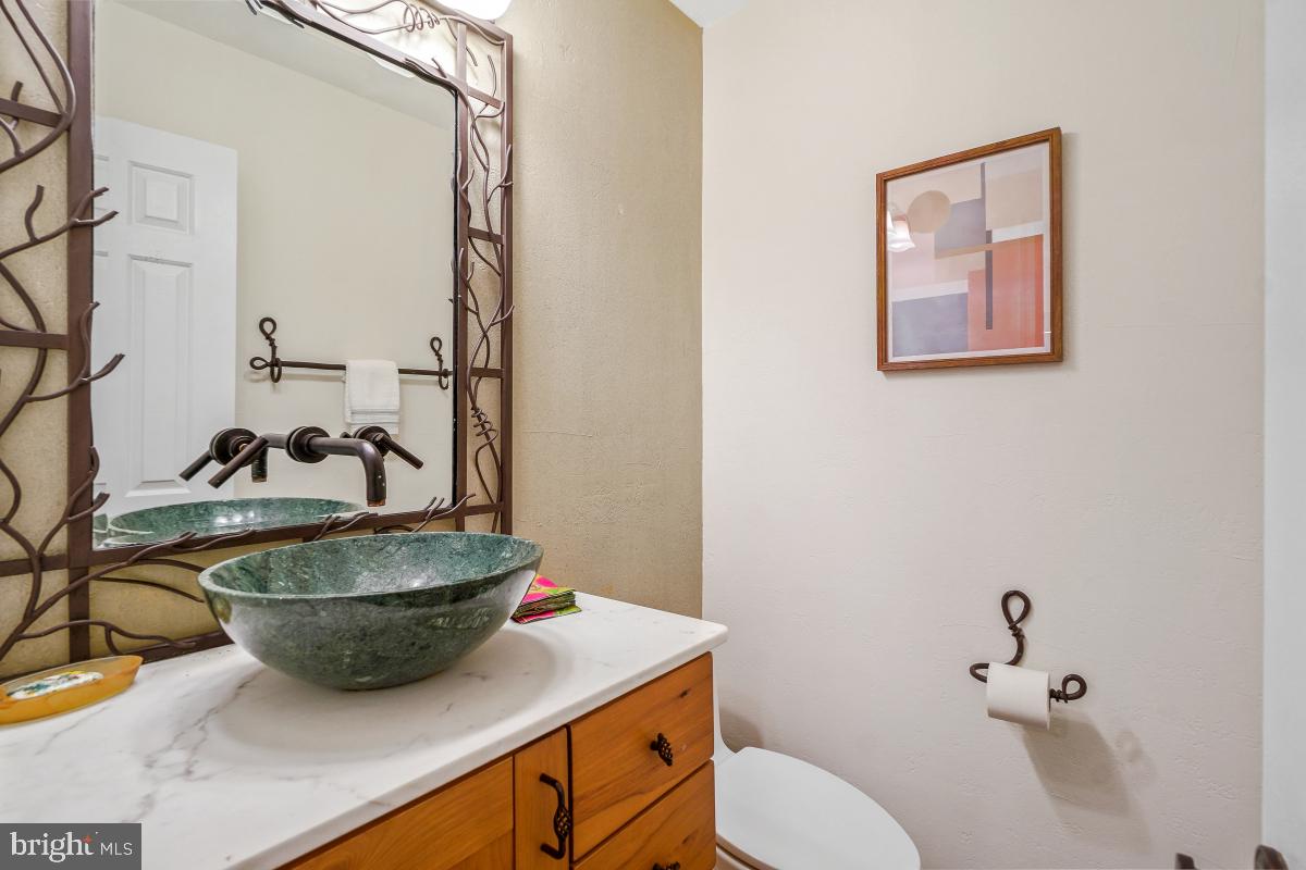 9804 Korman Court Potomac, MD 20854 - Photo 25 of 66 a room with a sink and a mirror