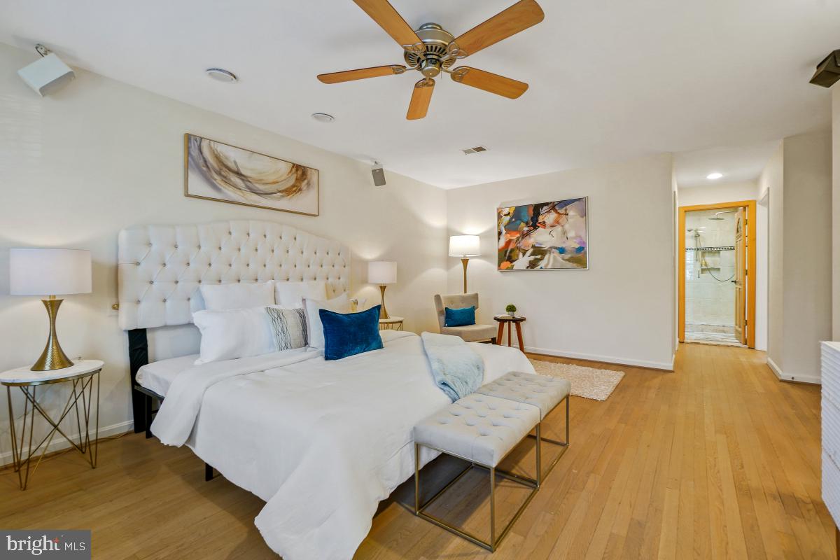 9804 Korman Court Potomac, MD 20854 - Photo 33 of 66 a bedroom with a bed and a table in it