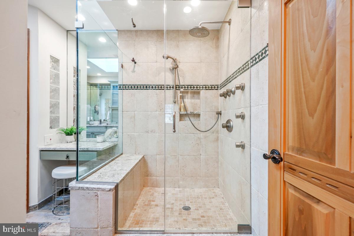 9804 Korman Court Potomac, MD 20854 - Photo 35 of 66 a bathroom with a shower and a sink