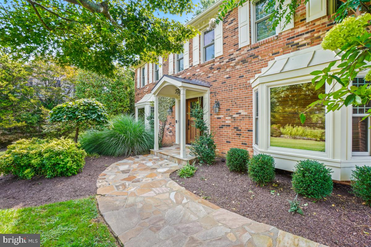 9804 Korman Court Potomac, MD 20854 - Photo 4 of 66 a front view of a house with garden