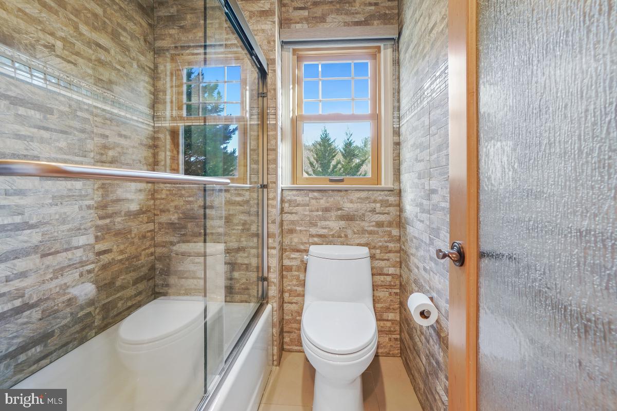9804 Korman Court Potomac, MD 20854 - Photo 45 of 66 a bathroom with a toilet and a shower