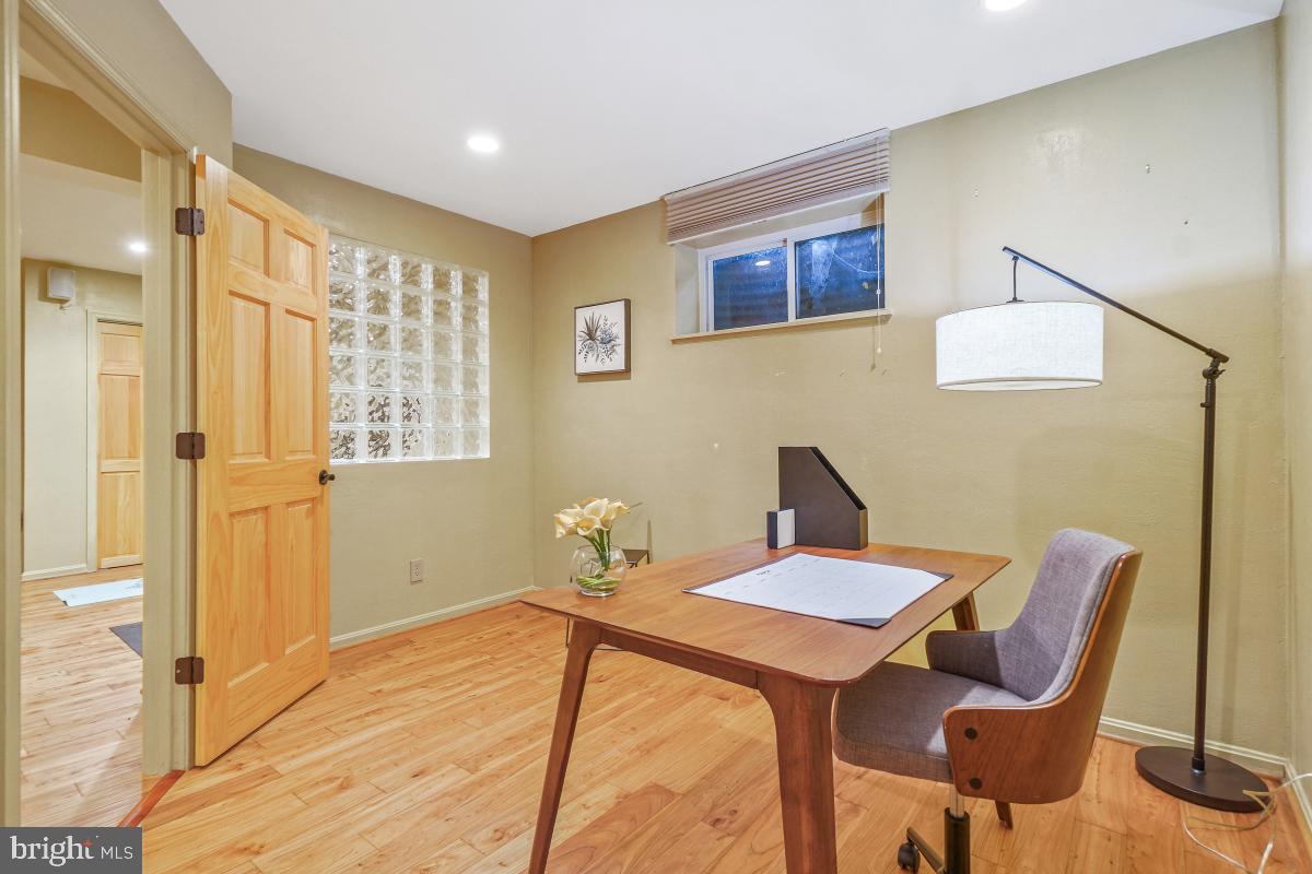9804 Korman Court Potomac, MD 20854 - Photo 49 of 66 a view of a dining room with furniture and wooden floor