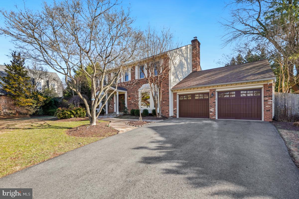 9804 Korman Court Potomac, MD 20854 - Photo 5 of 66 a view of a house with a yard and large tree