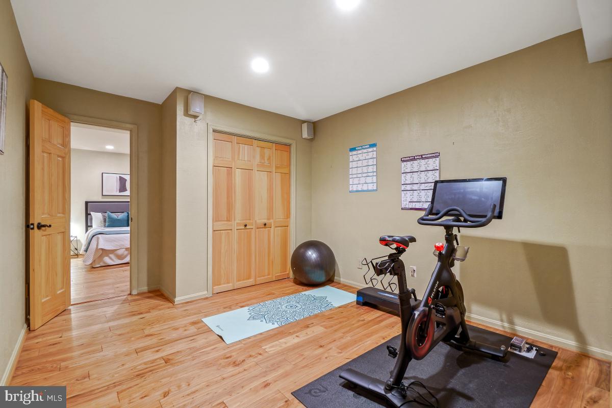 9804 Korman Court Potomac, MD 20854 - Photo 51 of 66 a view of a workspace with furniture and gym equipment