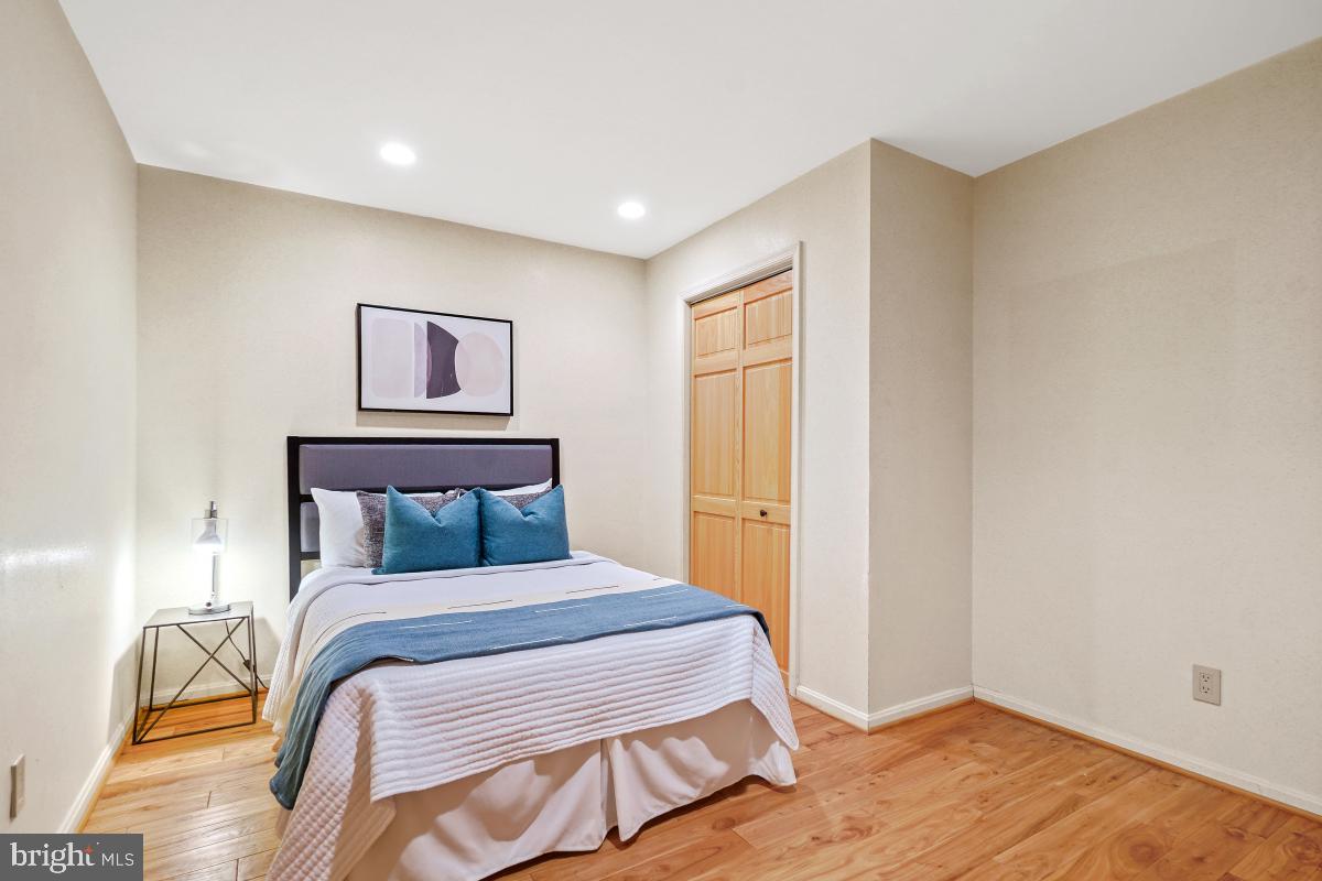 9804 Korman Court Potomac, MD 20854 - Photo 52 of 66 a bedroom with a bed and a painting