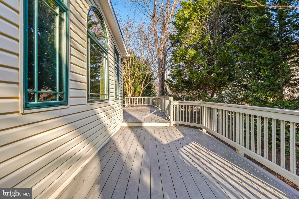 9804 Korman Court Potomac, MD 20854 - Photo 55 of 66 a view of balcony with wooden floor and fence