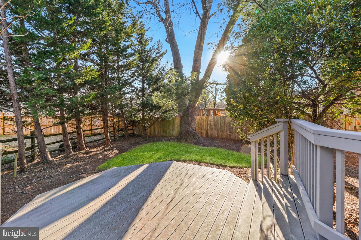 9804 Korman Court Potomac, MD 20854 - Photo 56 of 66 a view of a backyard with wooden fence