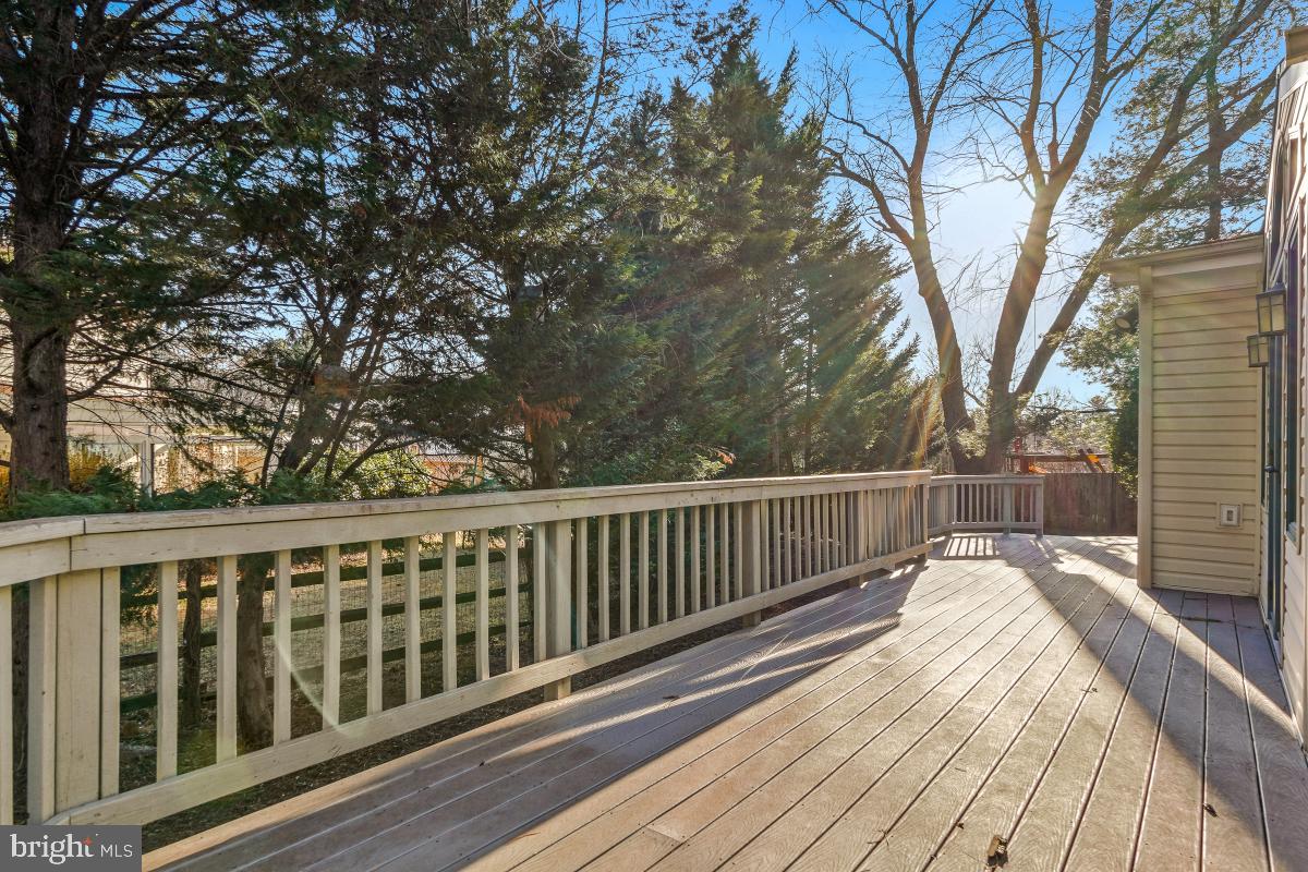 9804 Korman Court Potomac, MD 20854 - Photo 59 of 66 a view of balcony with wooden floor and fence