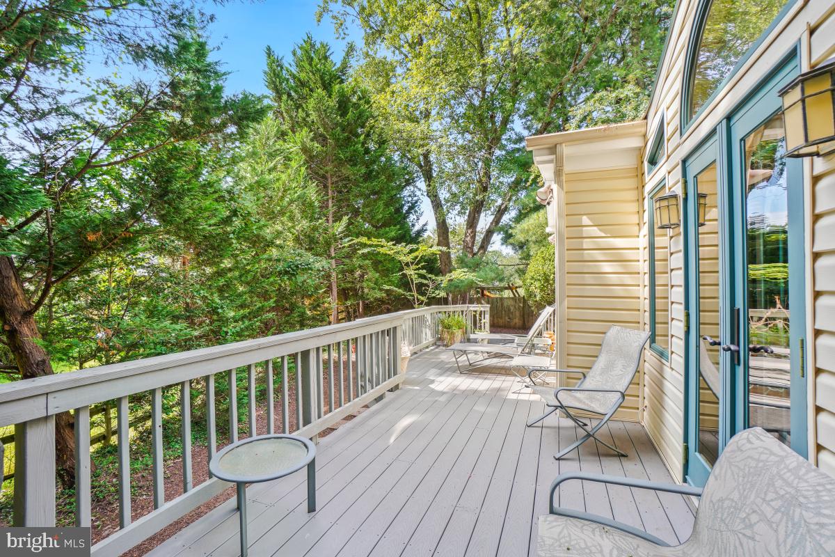 9804 Korman Court Potomac, MD 20854 - Photo 63 of 66 a view of balcony with wooden floor and outdoor seating