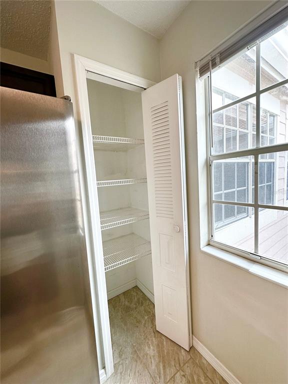 654 Roaring Drive, Unit 228 Altamonte Springs, FL 32714 - Photo 18 of 37 a view of a room with a window and wooden floor