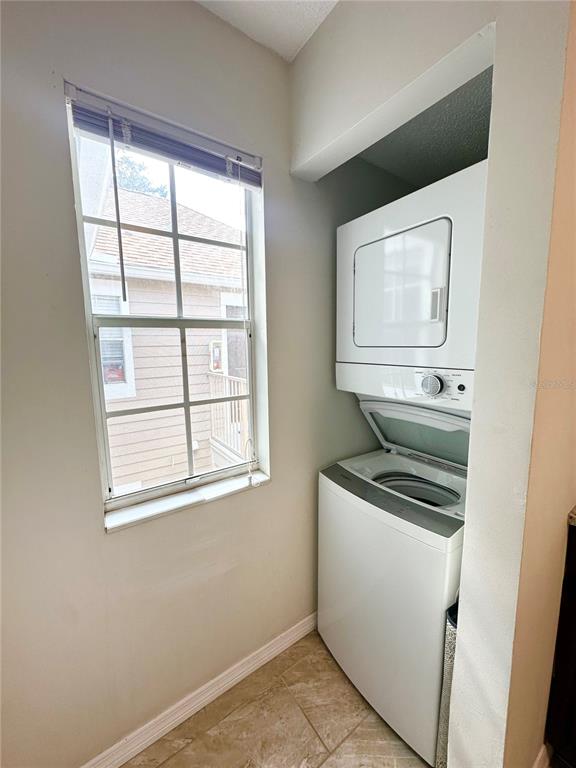 654 Roaring Drive, Unit 228 Altamonte Springs, FL 32714 - Photo 19 of 37 a utility room with dryer and washer