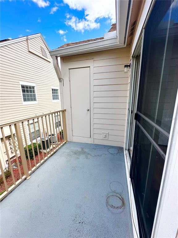 654 Roaring Drive, Unit 228 Altamonte Springs, FL 32714 - Photo 34 of 37 a view of a porch with a door