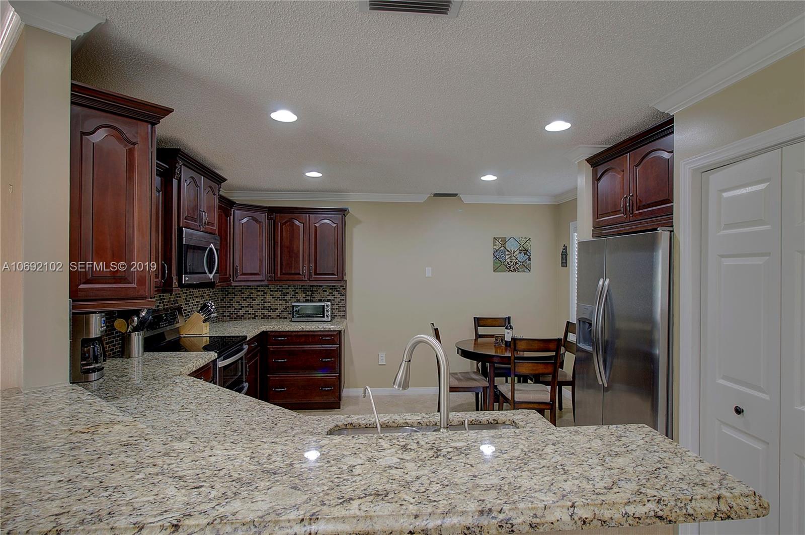 4113 Sapphire Bend Weston, FL 33331 - Photo 17 of 30 a view of a workspace with furniture