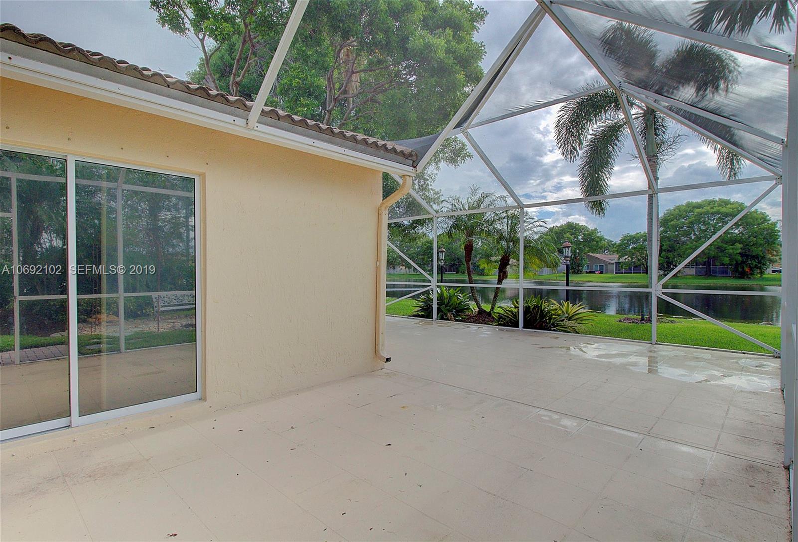 4113 Sapphire Bend Weston, FL 33331 - Photo 26 of 30 a view of outdoor space with backyard