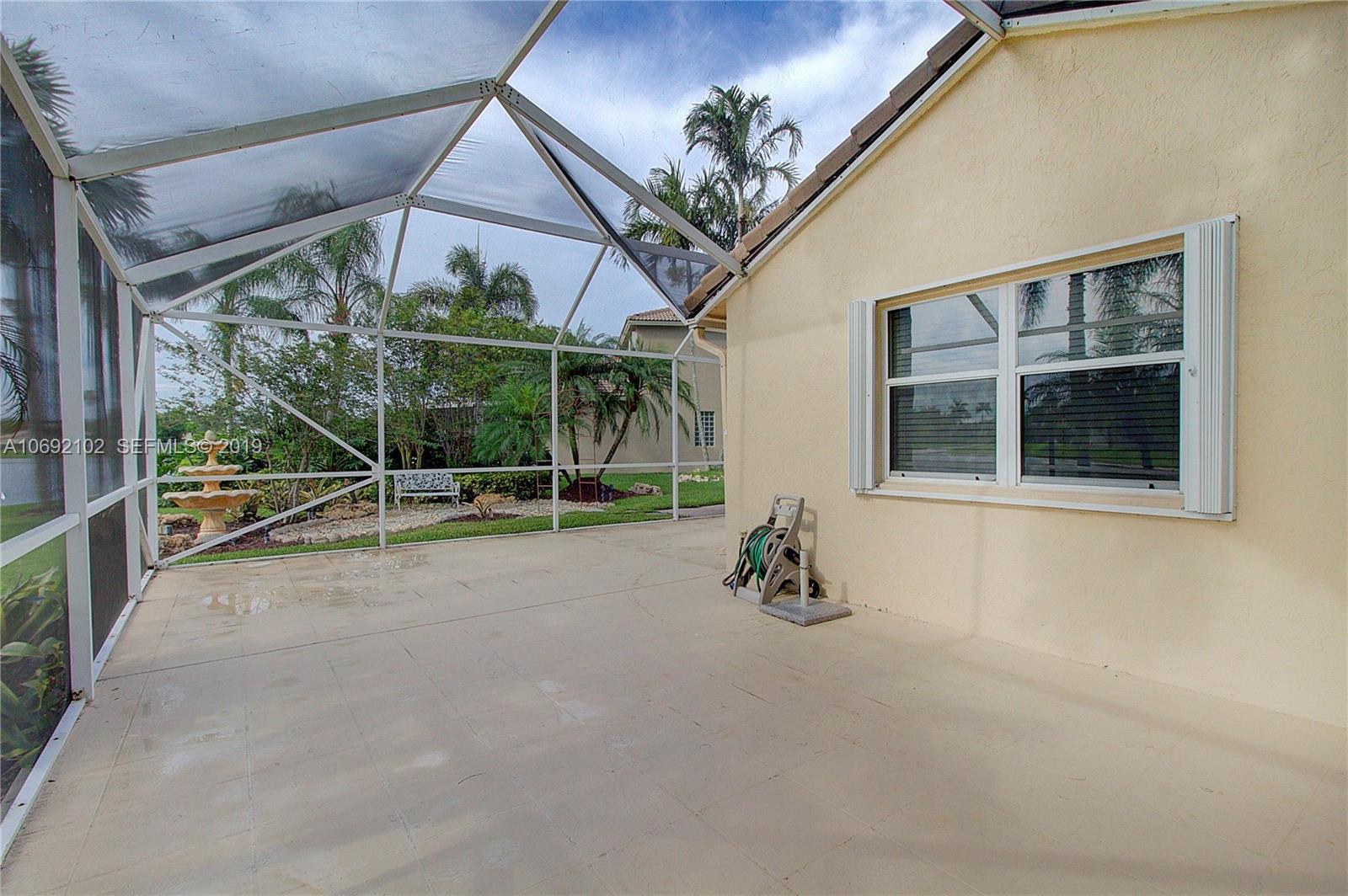 4113 Sapphire Bend Weston, FL 33331 - Photo 27 of 30 a view of a house with porch and windows
