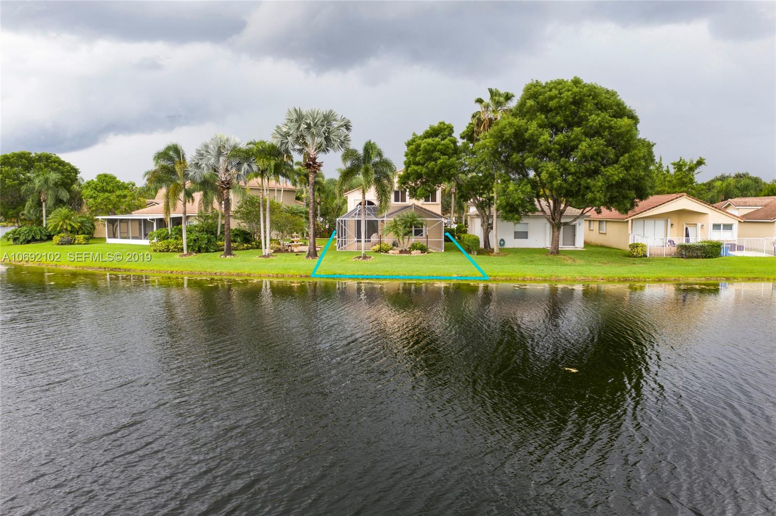 4113 Sapphire Bend Weston, FL 33331 - Photo 3 of 30 a view of residential houses with outdoor space and lake view