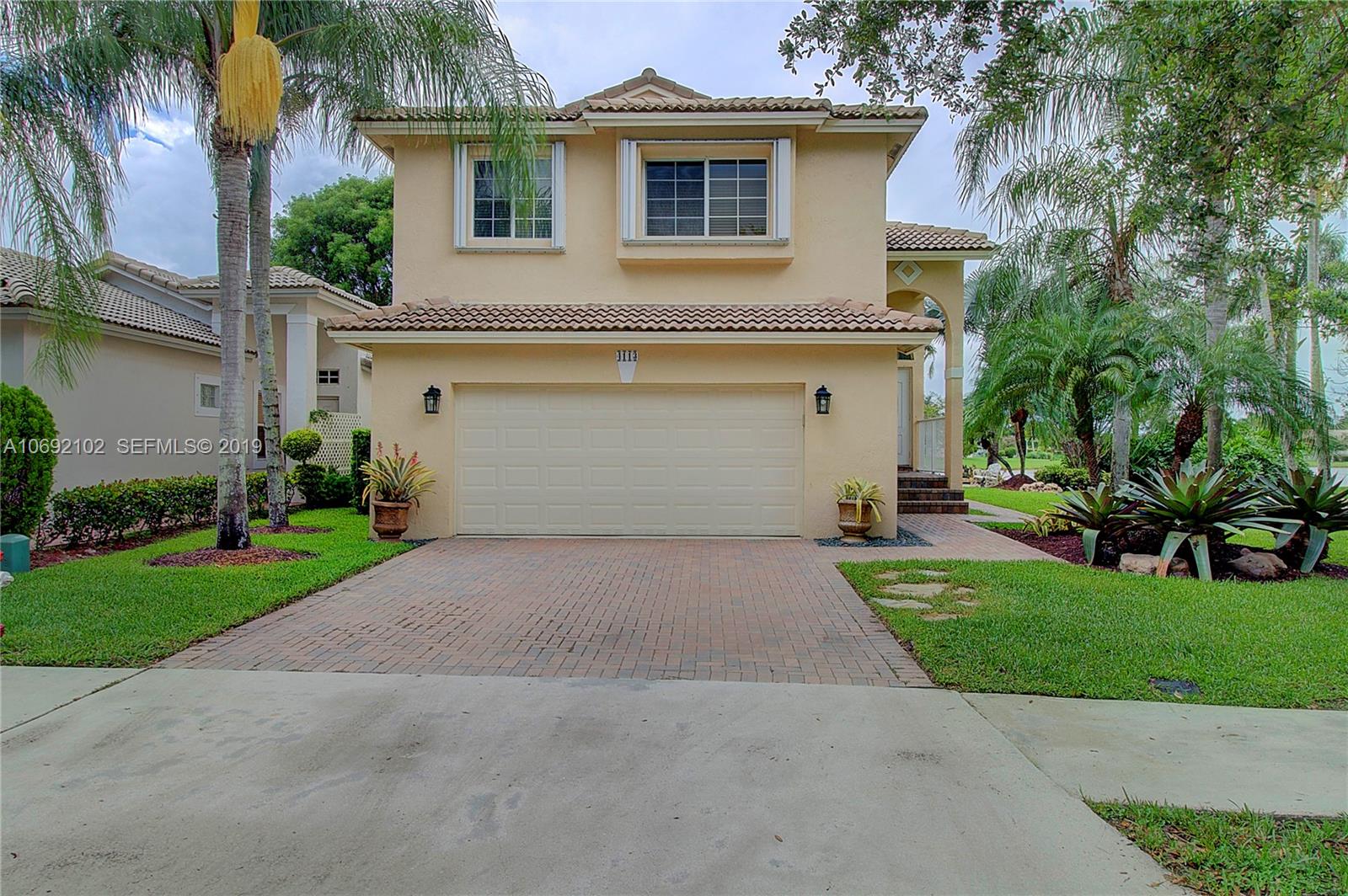 4113 Sapphire Bend Weston, FL 33331 - Photo 4 of 30 a front view of house with yard