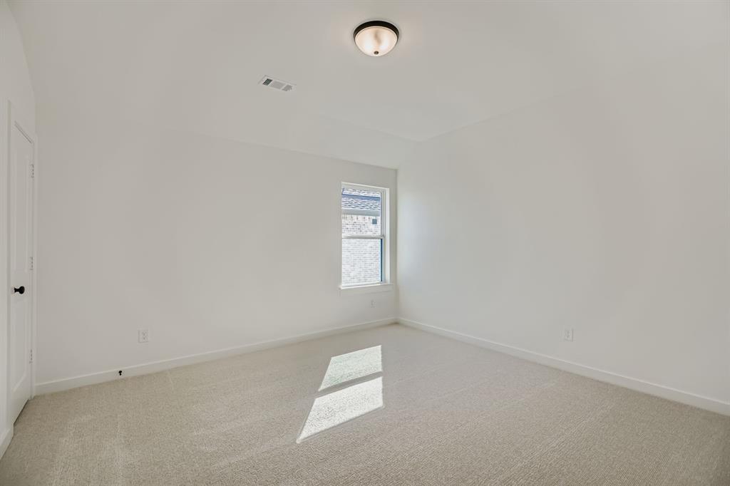 2300 Berman Street Celina, TX 75009 - Photo 21 of 29 an empty room with windows