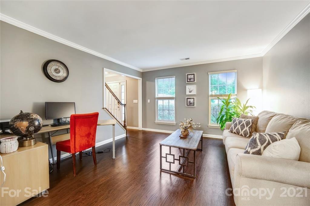 11145 Carver Pond Road Charlotte, NC 28269 - Photo 13 of 30 a living room with furniture and wooden floor