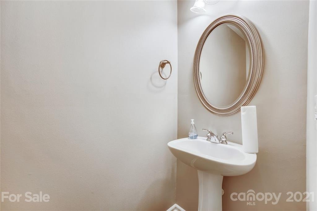 11145 Carver Pond Road Charlotte, NC 28269 - Photo 27 of 30 a bathroom with a sink and a mirror
