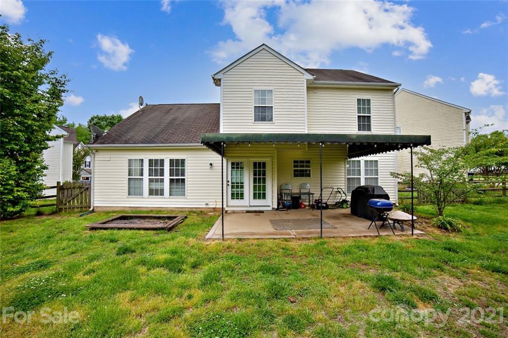 11145 Carver Pond Road Charlotte, NC 28269 - Photo 28 of 30 a view of a house with a yard and sitting area