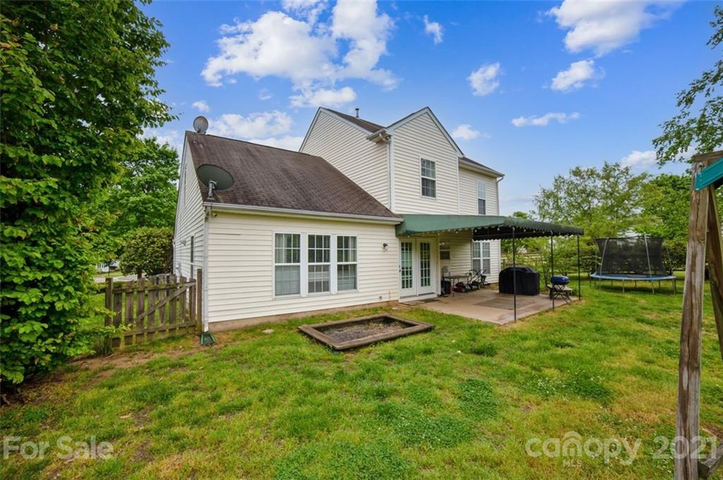 11145 Carver Pond Road Charlotte, NC 28269 - Photo 29 of 30 a view of a house with a yard and sitting area