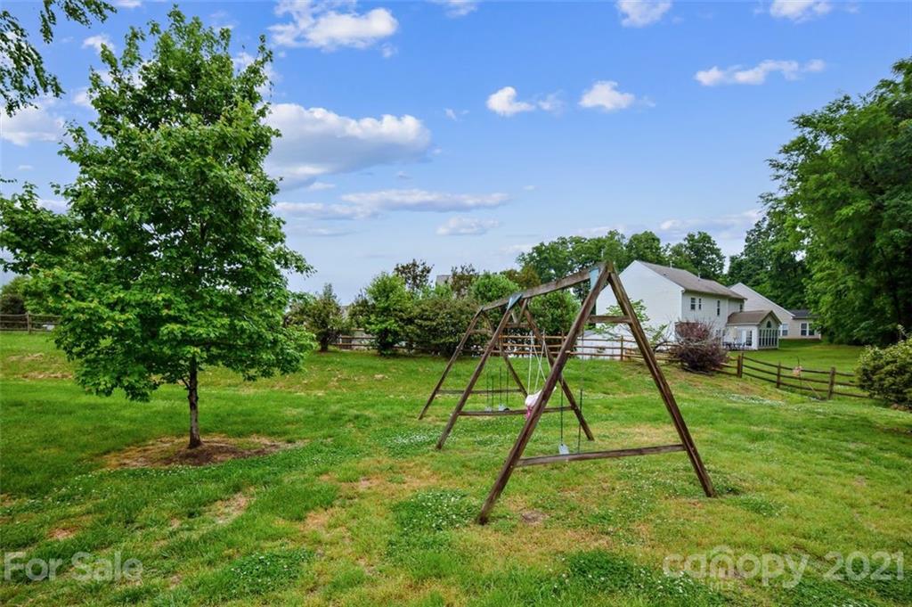 11145 Carver Pond Road Charlotte, NC 28269 - Photo 30 of 30 a view of a house with a backyard