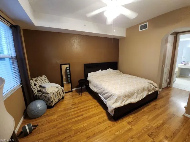 a bedroom with double bed and window