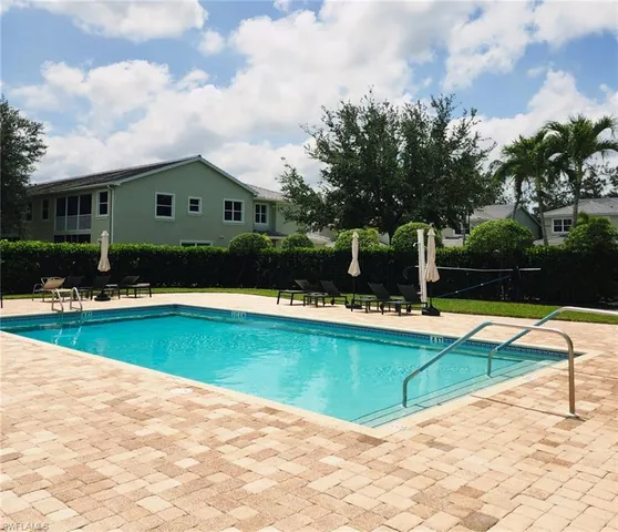 a view of swimming pool with lounge area