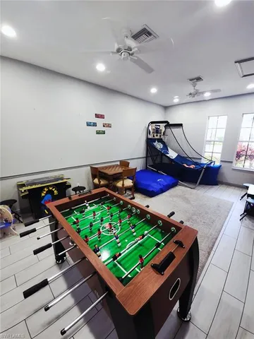 a room with gym equipment and a table