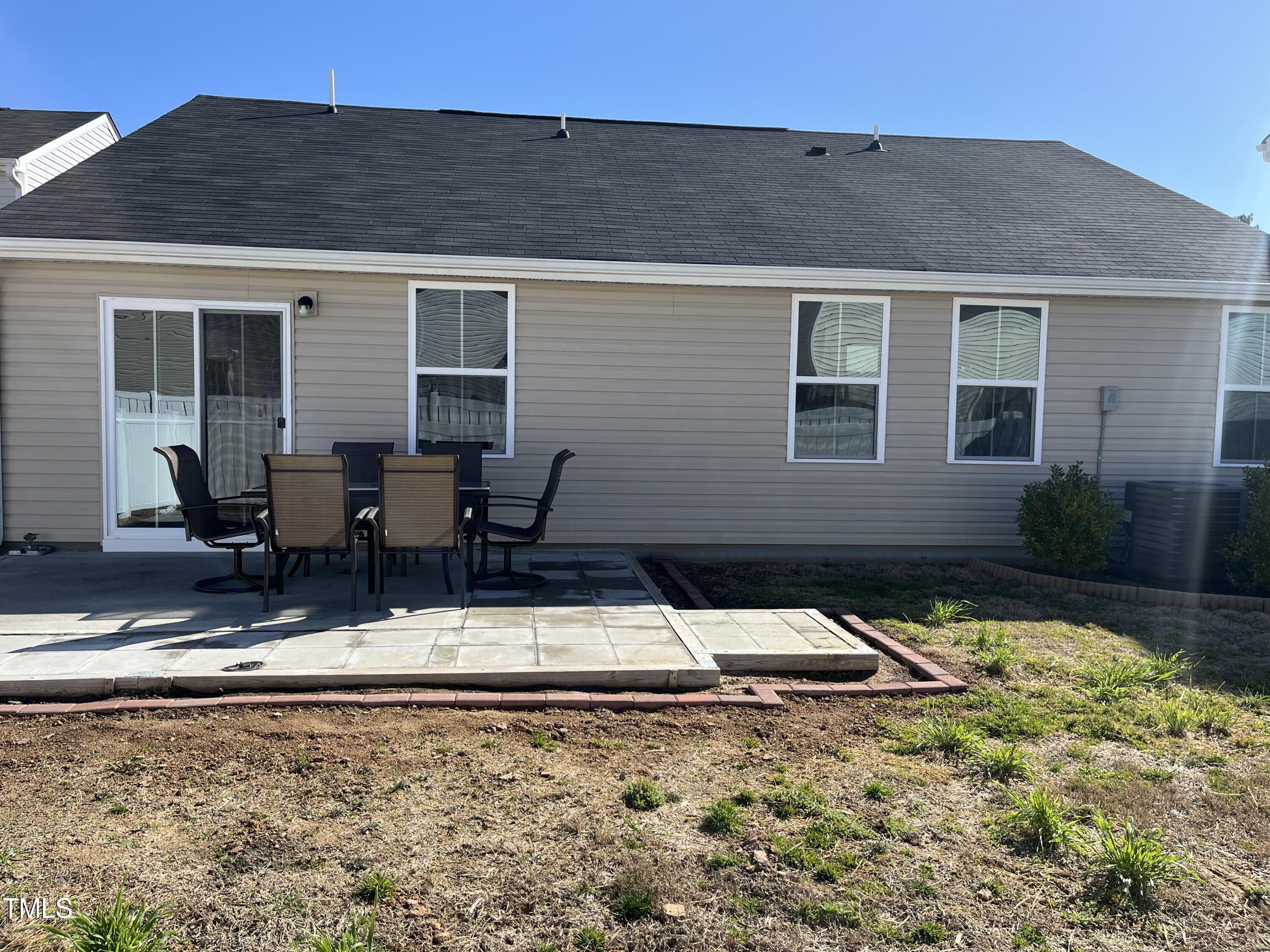 1408 Bridgewater Drive Durham, NC 27704 - Photo 12 of 41 a backyard of a house with yard and outdoor seating