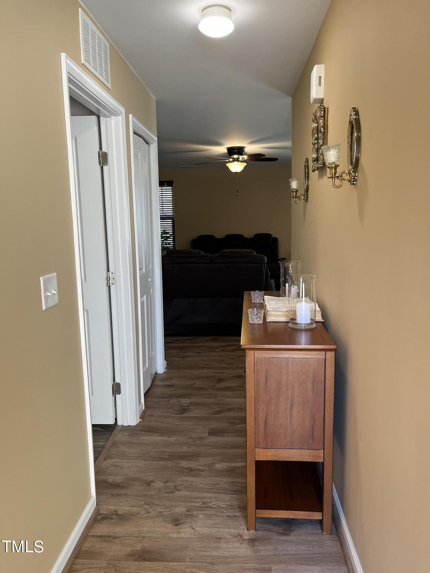 1408 Bridgewater Drive Durham, NC 27704 - Photo 20 of 41 a kitchen with a refrigerator and a wooden floor
