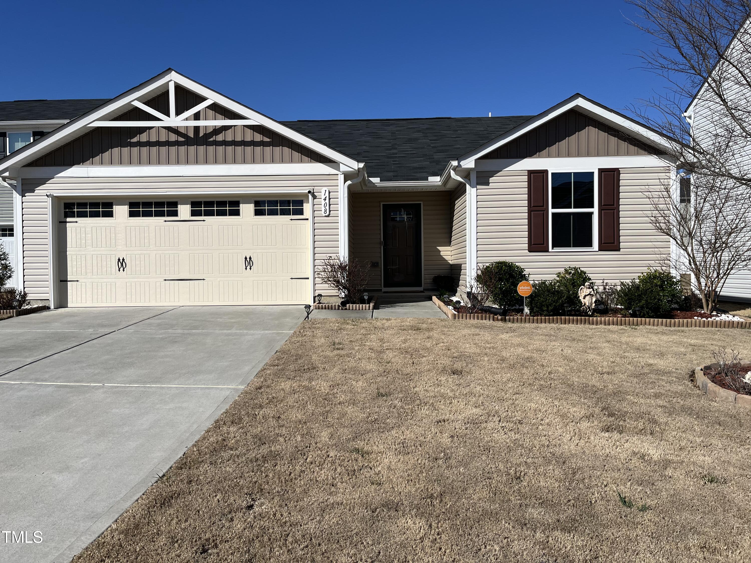 1408 Bridgewater Drive Durham, NC 27704 - Photo 2 of 41 a front view of a house with a yard